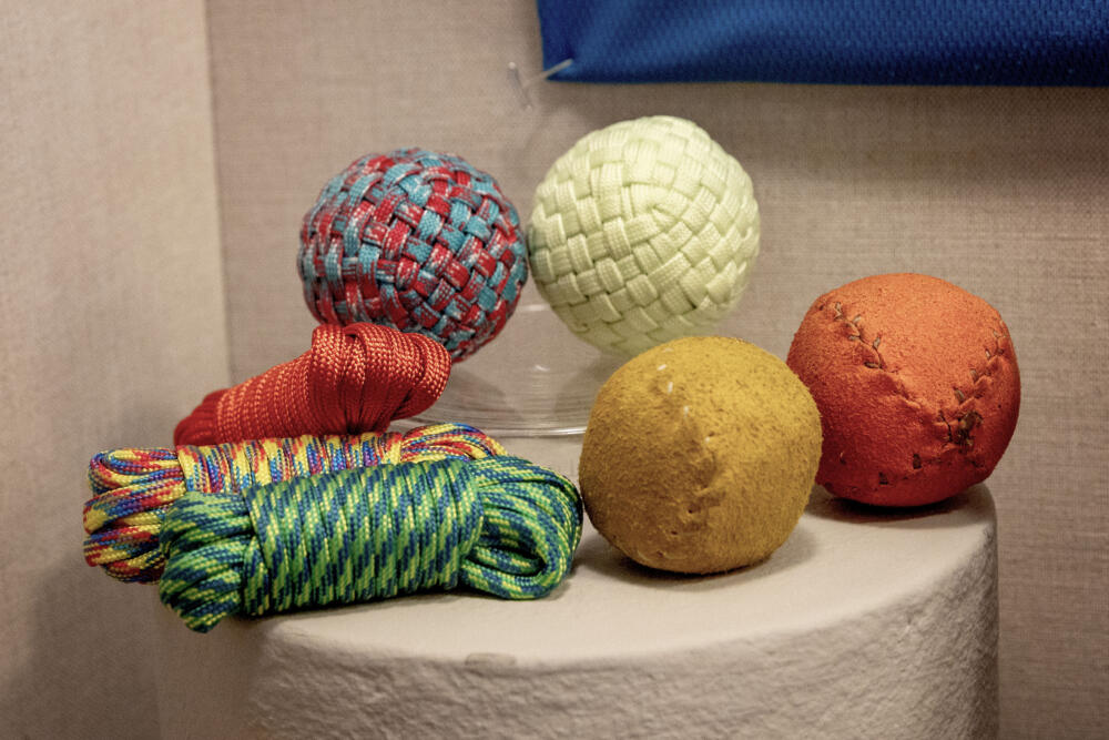 Stickball balls made from leather and cord at the "Stickball @ Harvard" exhibit at Harvard's Peabody Museum, in Cambridge. (Robin Lubbock/WBUR)