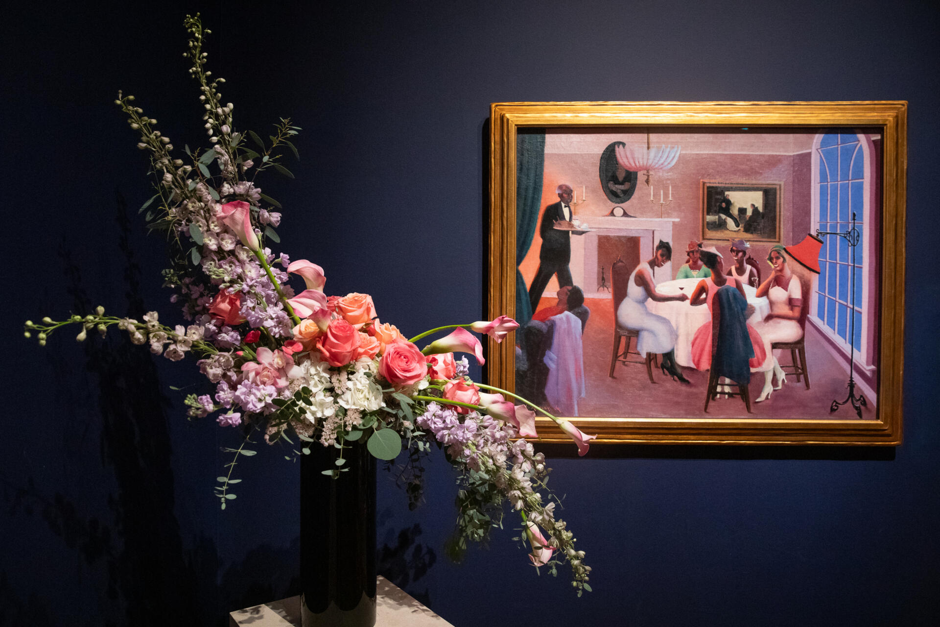 A floral arrangement from the Garden Club of the Back Bay inspired by the painting “Cocktails” by Archibald Motley. (Artemisia Luk/WBUR)