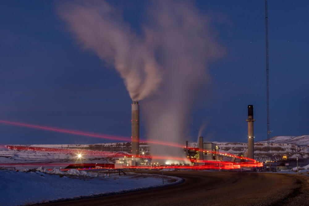Taillights trace the path of a motor vehicle at the Naughton Power Plant in Kemmerer, Wyo., on Jan. 13, 2022. (Natalie Behring, File/ AP)