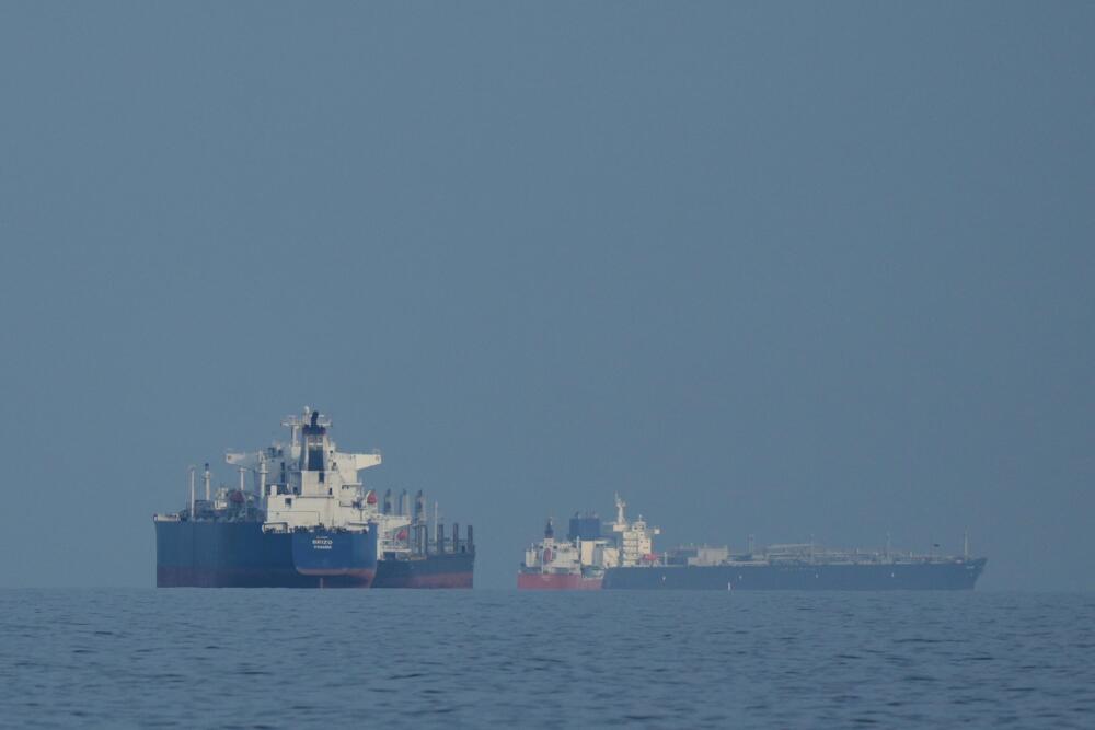 Oil tankers and cargo ships line up in the Strait of Hormuz as seen from Khor Fakkan, United Arab Emirates, Wednesday, March 11, 2026. (Altaf Qadri/AP)