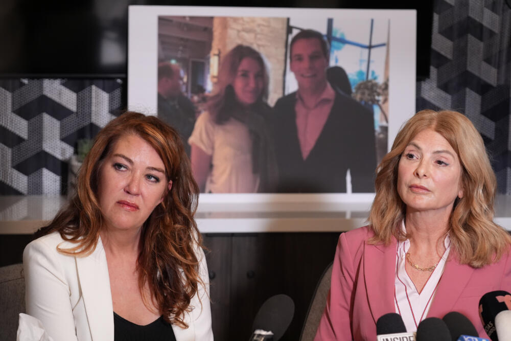 Lonna Drewes joins her lawyer Lisa Bloom at a news conference in Beverly Hills, Calif., Tuesday, April 14, 2026, to detail allegations of sexual misconduct by Rep. Eric Swalwell, after Swalwell exited the California governor's race and said he'll resign his seat in Congress. (Damian Dovarganes/AP)