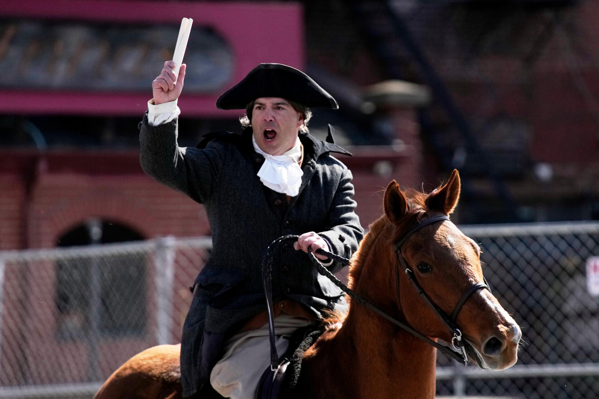 Brig. Gen. Richard Reale, dressed as Paul Revere, reenacts the 1775 Boston-to-Lexington ride to alert colonists of approaching British troops. (Robert F. Bukaty/AP)