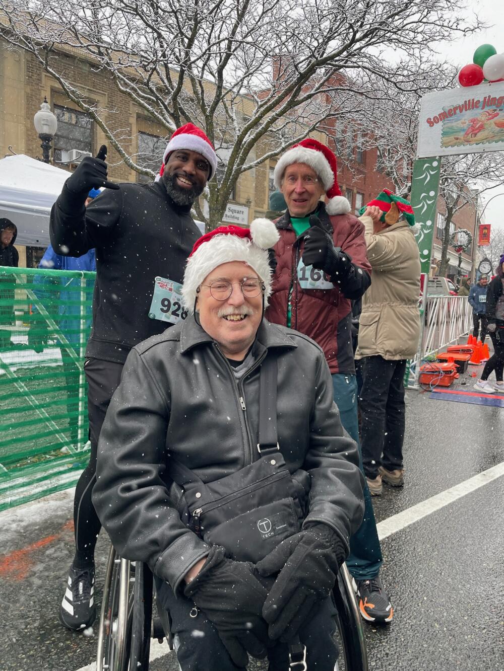 Bob Hall, Bill Rodgers (right) and a member of the REquipment team at the Jingle Bell Run in Somerville in December 2025. (Courtesy Bob Hall Legacy Fund)