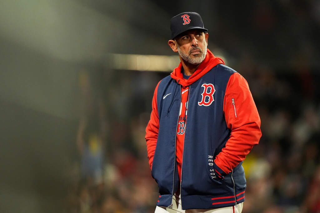 Boston Red Sox manager Alex Cora walks off the field after a talk with the home plate umpire during the sixth of a baseball game against the Milwaukee Brewers Tuesday, April 7, 2026, in Boston. (Robert F. Bukaty/AP)