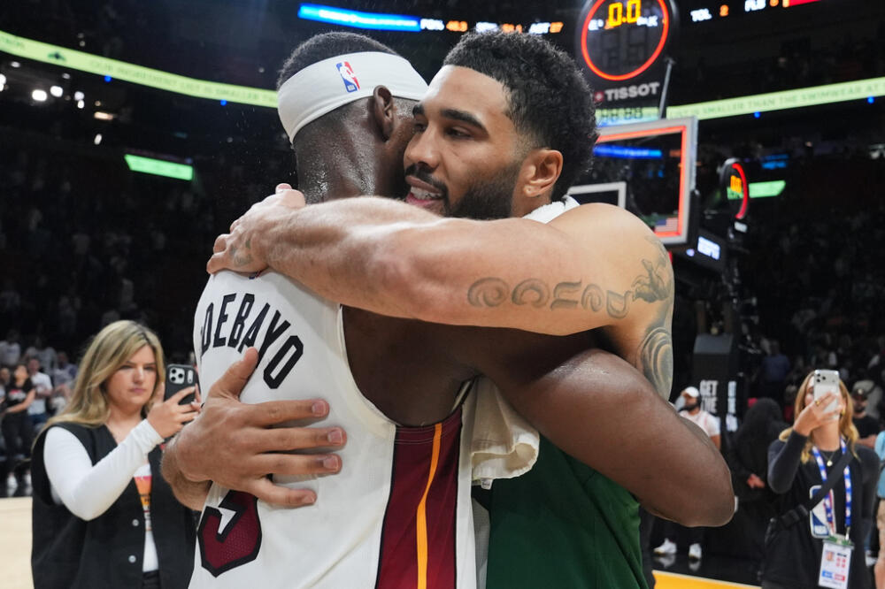 Miami Heat center Bam Adebayo (13) and Boston Celtics forward Jayson Tatum, right, embrace after an NBA basketball game, Wednesday, April 1, 2026, in Miami. (Lynne Sladky/AP)
