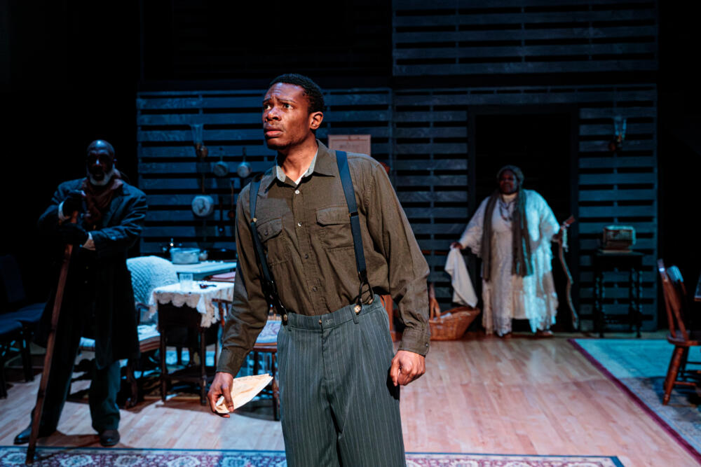 Joshua Lee Robinson (center) with Jonathan Kitt and Regine Vital in Actors’ Shakespeare Project’s production of August Wilson’s "Gem of the Ocean." (Courtesy Benjamin Rose Photography)