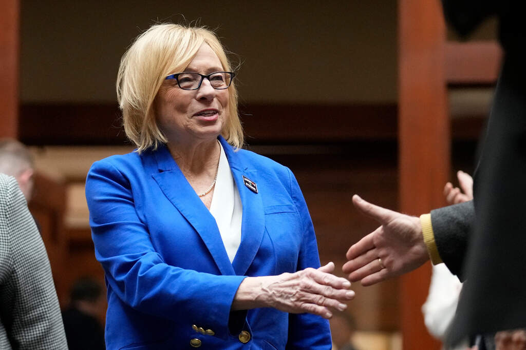 Democratic Gov. Janet Mills, greets lawmakers prior to delivering her State of the State address, Jan. 30, 2024, at the State House in Augusta, Maine. (Robert F. Bukaty/AP, File)