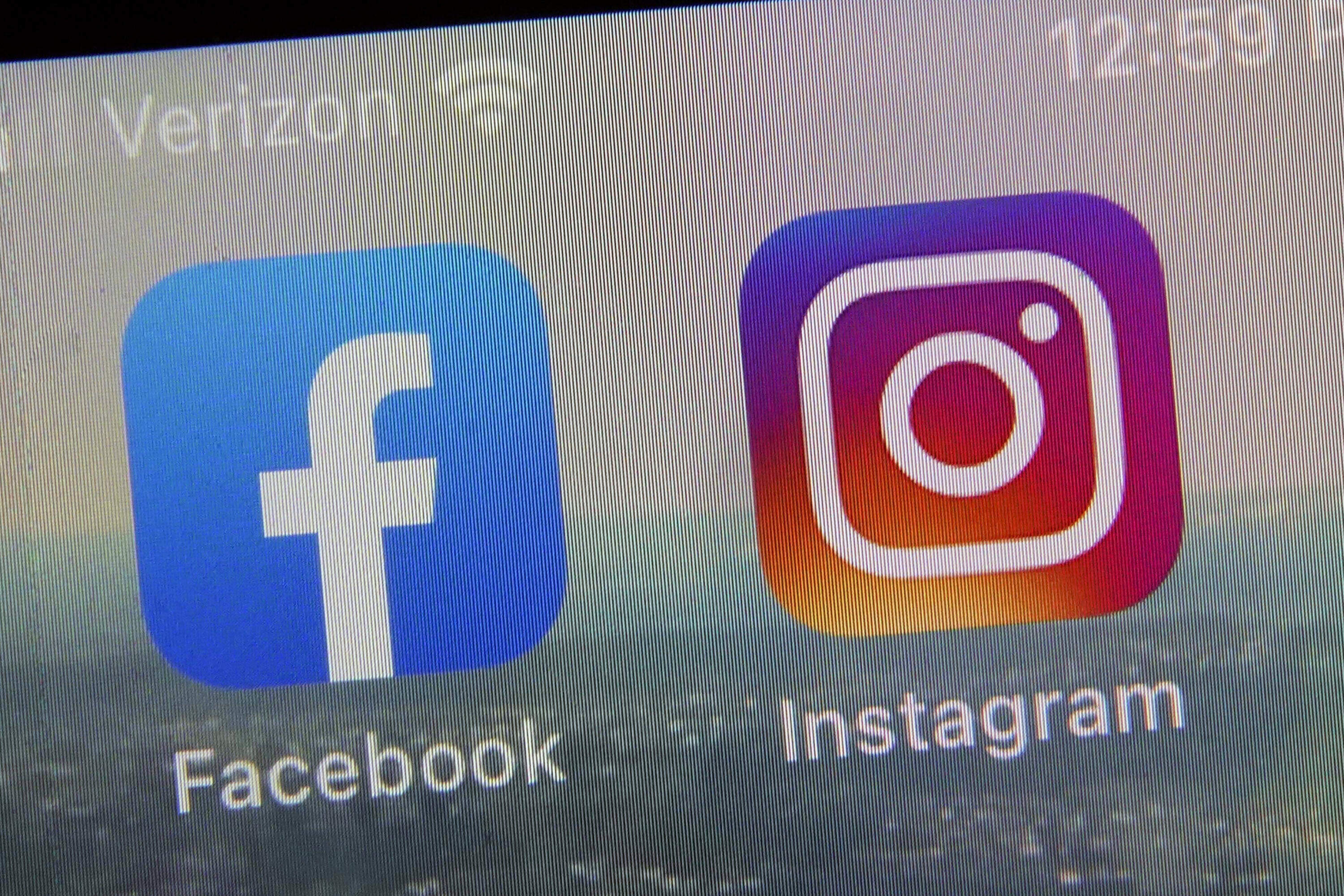 The mobile app logos for Facebook and Instagram. (Richard Drew/AP)