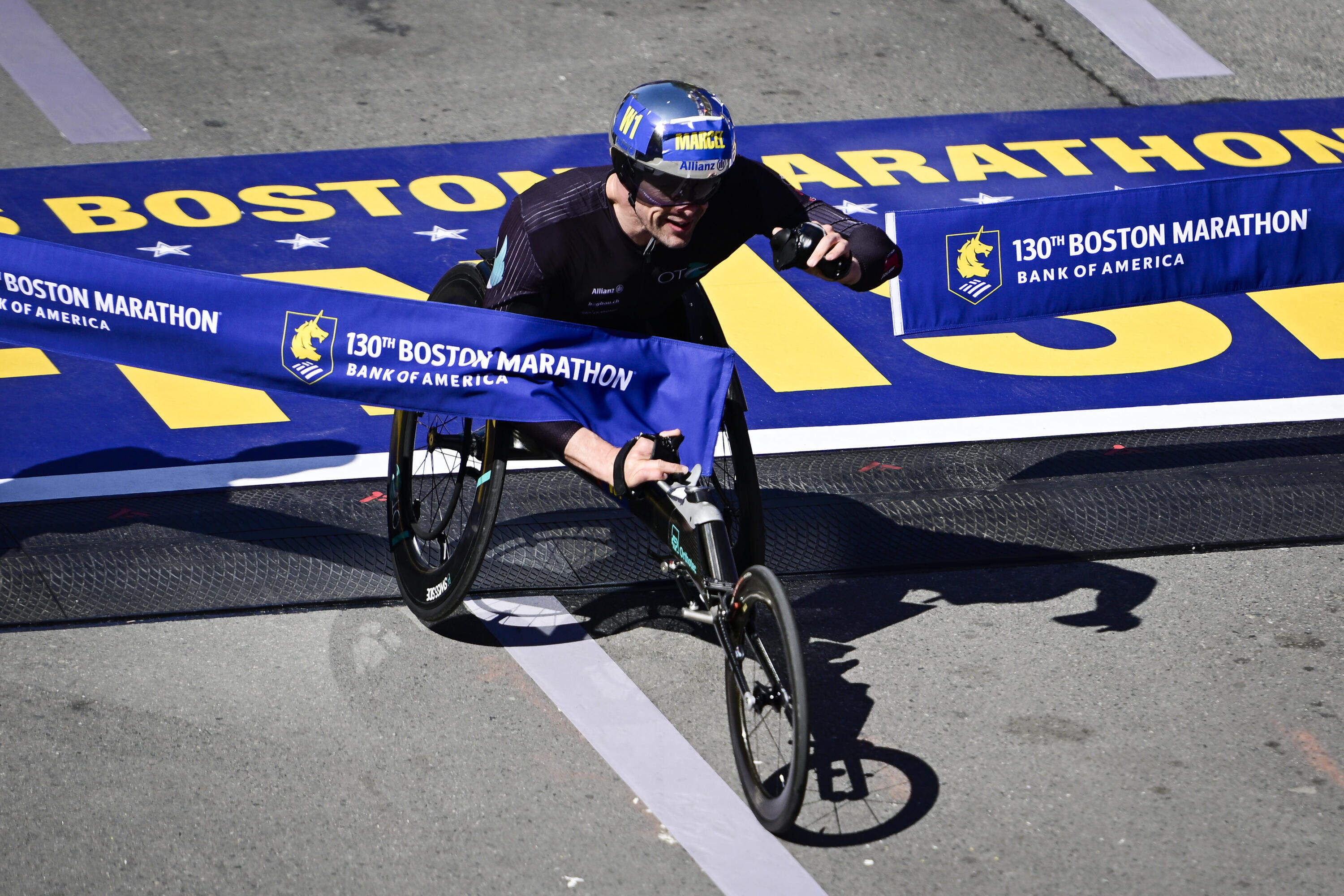 Boston Marathon finish line on Boylston Street with runners and spectators
