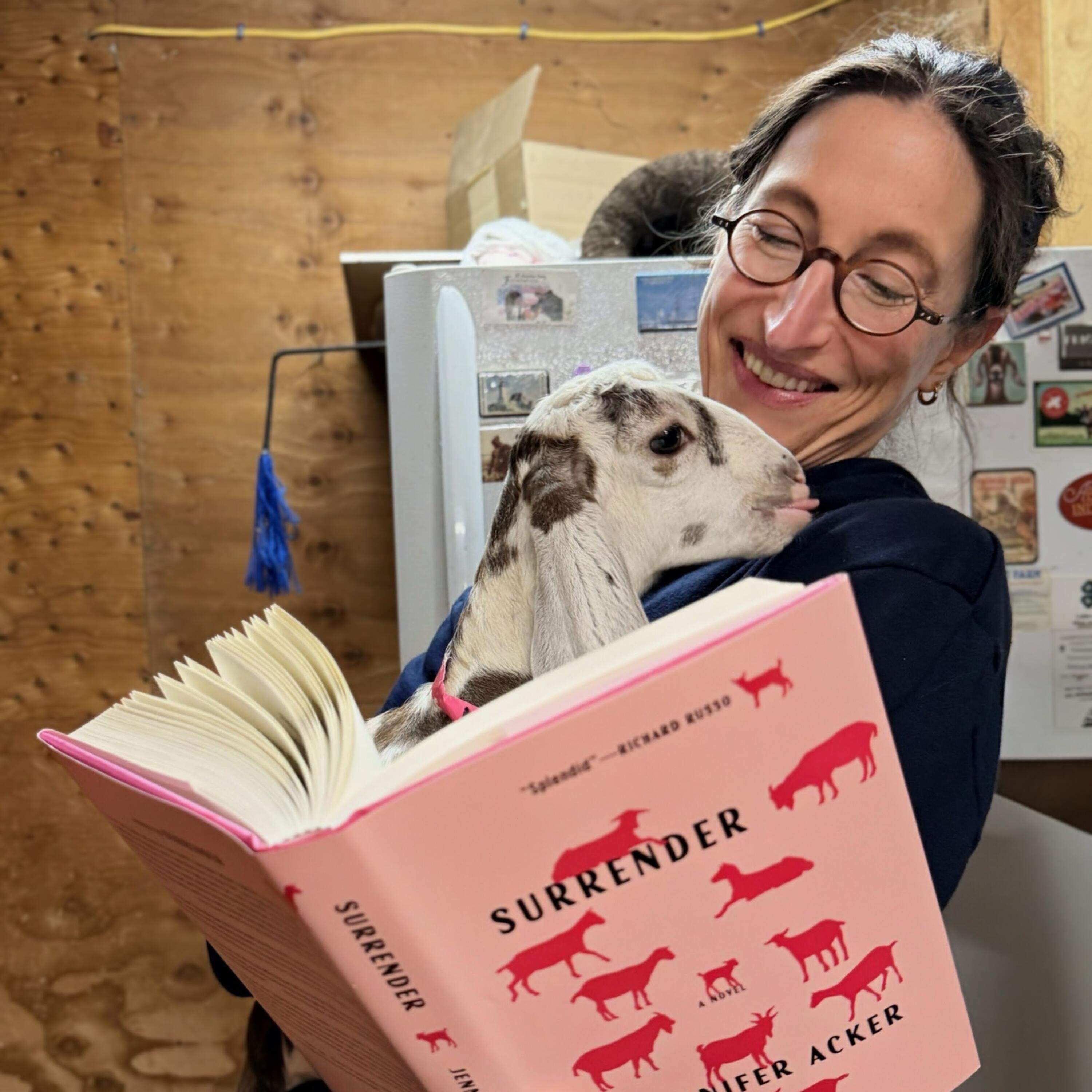 Author Jennifer Acker holds her book "Surrender" and a goat from Thomas Farm & Dairy in Sunderland, Mass. (Courtesy Jennifer Acker)