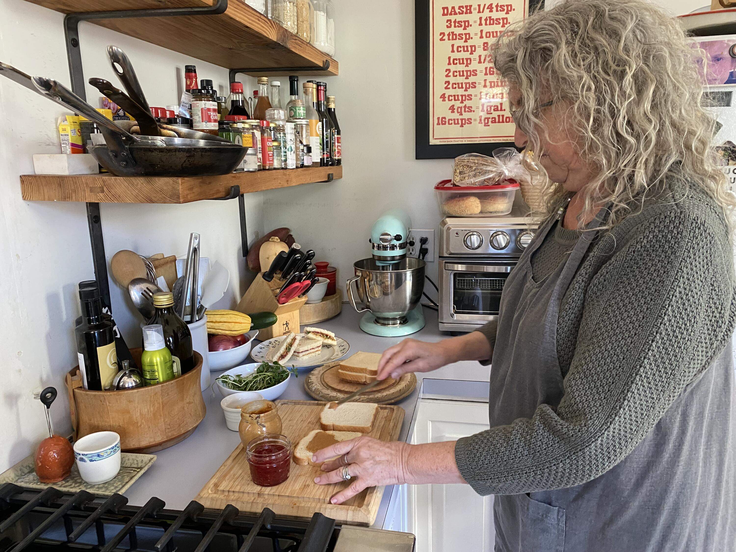 Food historian Susan Benjamin makes a peanut butter and jelly sandwich. (Andrea Shea/WBUR)