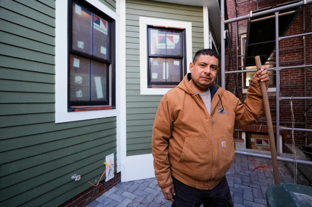 General contractor José Urías pauses while working at a high-end apartment his crew is remodeling, Wednesday, March 25, 2026, in Charlestown, Mass. (AP Photo/Robert F. Bukaty)