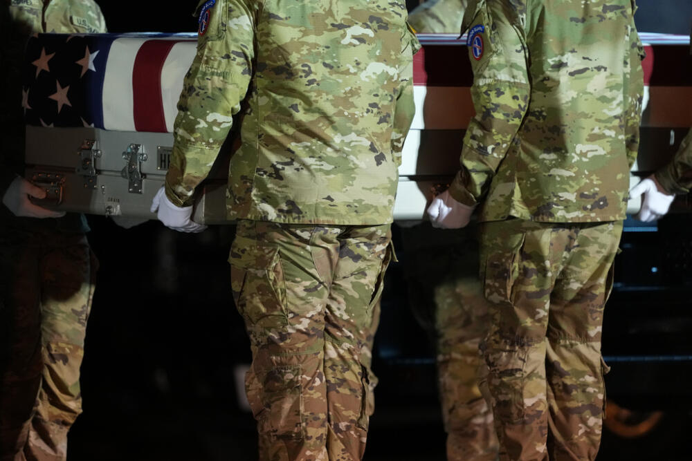 A U.S. Army carry team places the transfer case with the remains of U.S. Army Sgt. Benjamin N. Pennington, 26, of Glendale, Ky., the seventh U.S. service member to die in combat during the Iran war, in the the transfer vehicle during a dignified transfer Monday, March 9, 2026, at Dover Air Force Base, Del. (AP Photo/Julia Demaree Nikhinson)