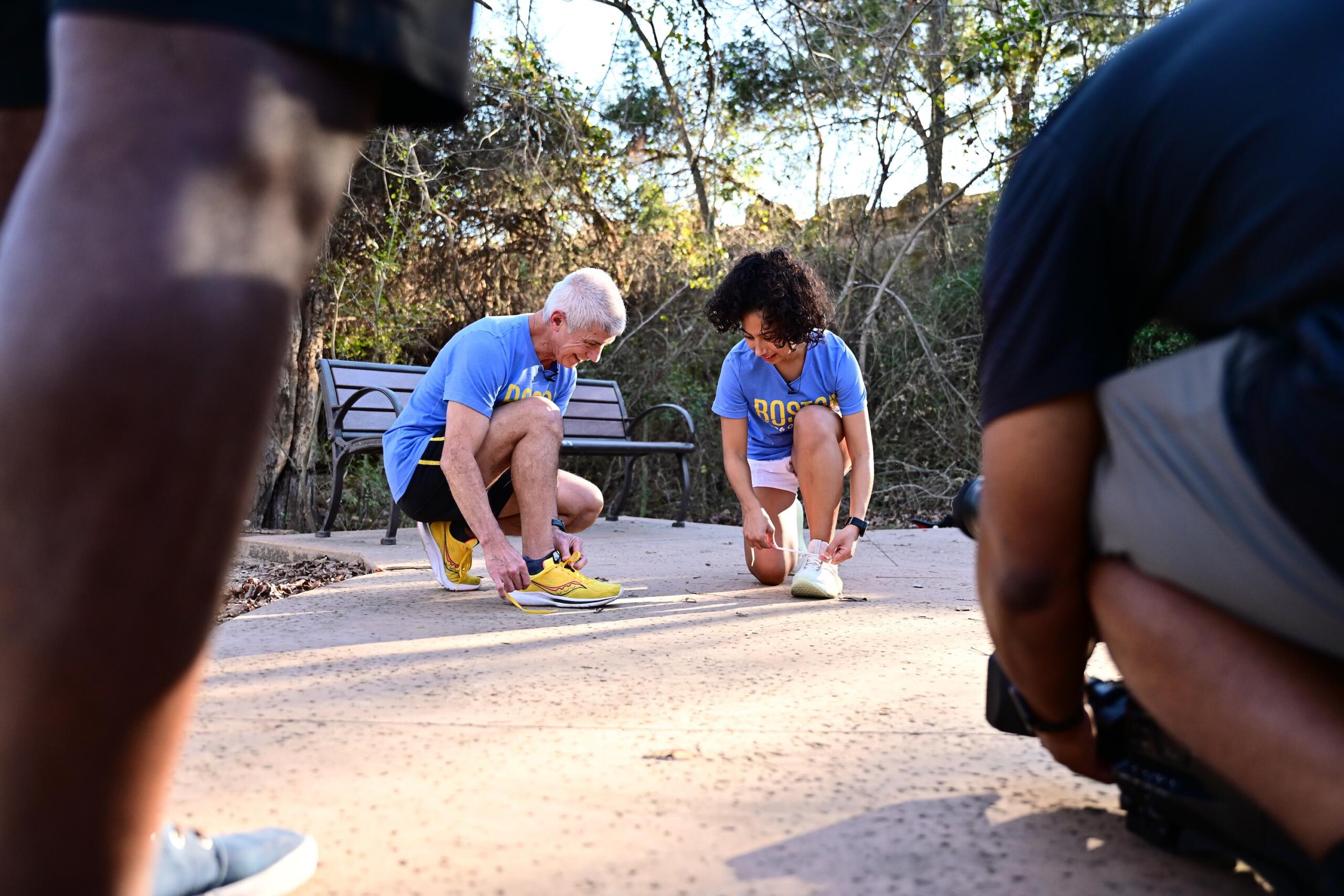 Carlos and Mia Sanchez lace up their shoes.