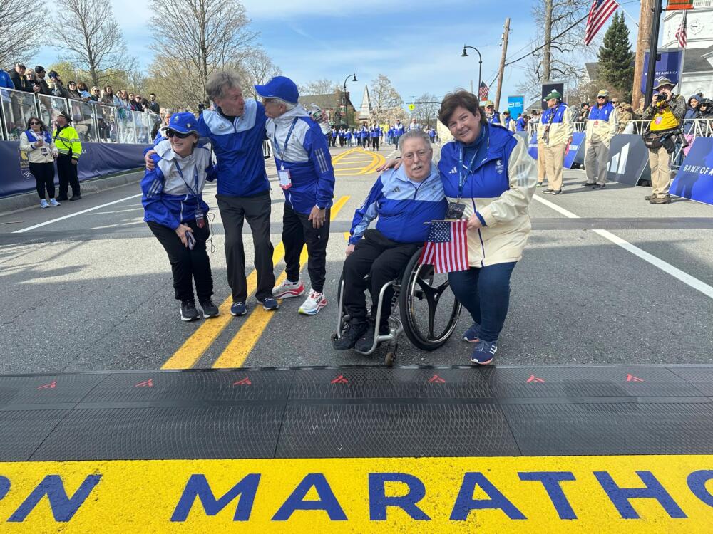 Wheelchair athlete pioneer Bob Hall, second right, serves as a grand marshal of the 129th Boston Marathon, Monday April 21, 2025. (Jennifer McDermott/AP, File)