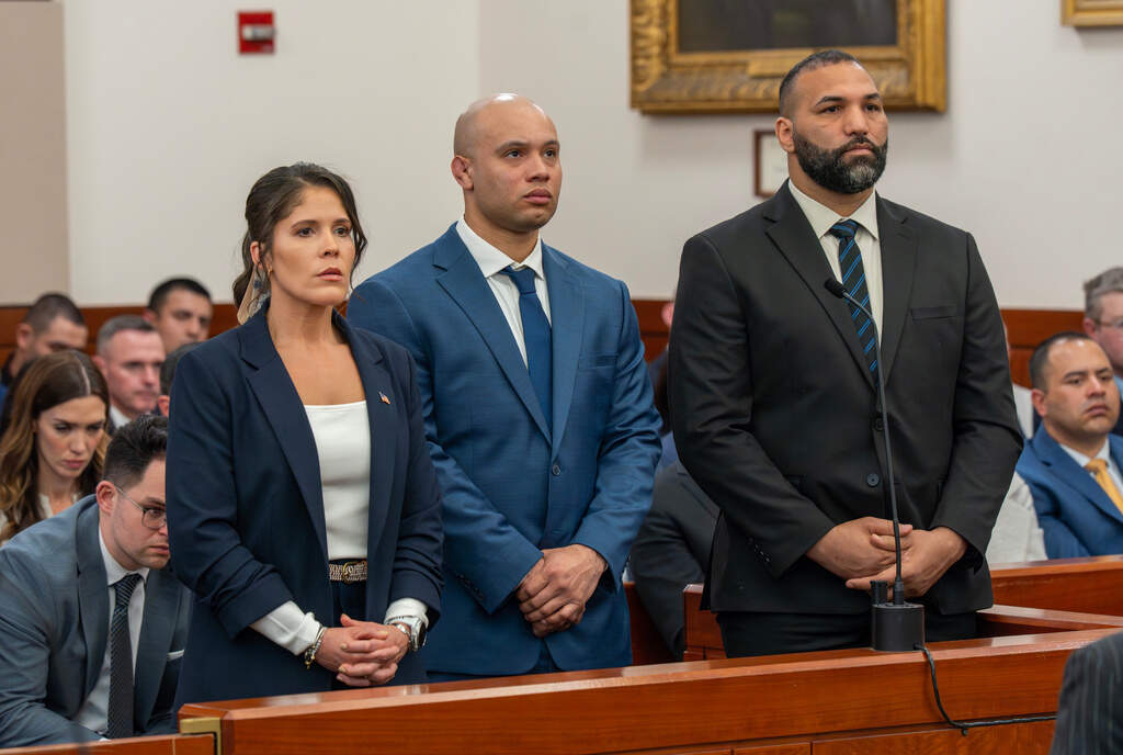Lt. Jennifer Penton and from left, troopers David Montanez and Edwin Rodriguez are arraigned in Worcester Superior Court on Thursday, April 2, 2026 in Worcester, Mass. (Rick Cinclair/Worcester Telegram & Gazette via AP)