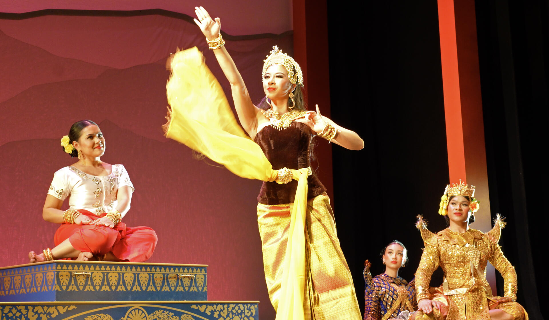 Sariah Sum (center) dances as the Princess of Indonesia in act five of “A Khmer Swan Lake" as Monica Veth (left) as the Queen Mother and Raine Yu and Peter Veth (right) look on. (Courtesy James Higgins)