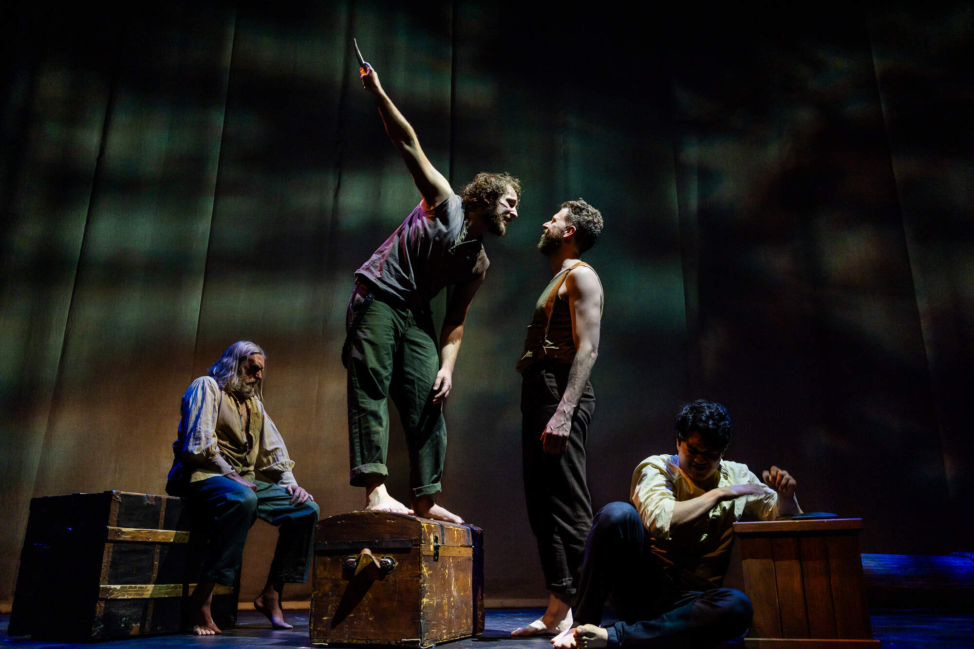 From left: Christopher Chew, Peter DiMaggio, Bishop Levesque and Max Connor in SpeakEasy Stage's production of "Swept Away." (Courtesy Nile Scott Studios)