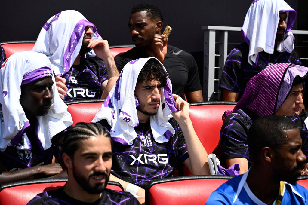 Players shield themselves from the sun before a Club World Cup soccer match in Washington, June 26, 2025. (Nick Wass/AP, File)