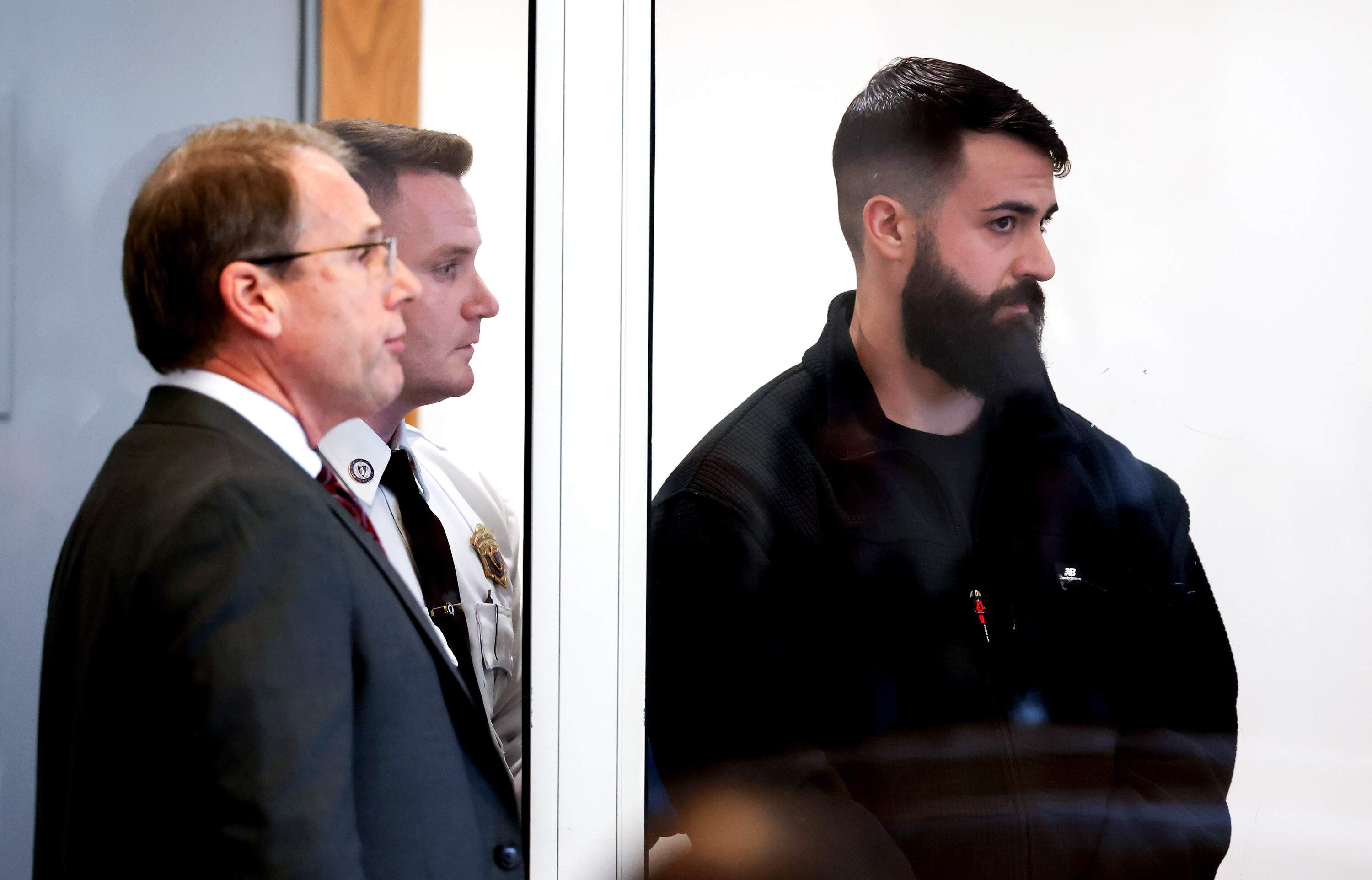 Boston Police Officer Nicholas O'Malley, right, during his arraignment in Roxbury Municipal Court in Boston on March 19 for manslaughter charges in the fatal shooting of Stephenson King. (Jonathan Wiggs/The Boston Globe, Pool via AP)