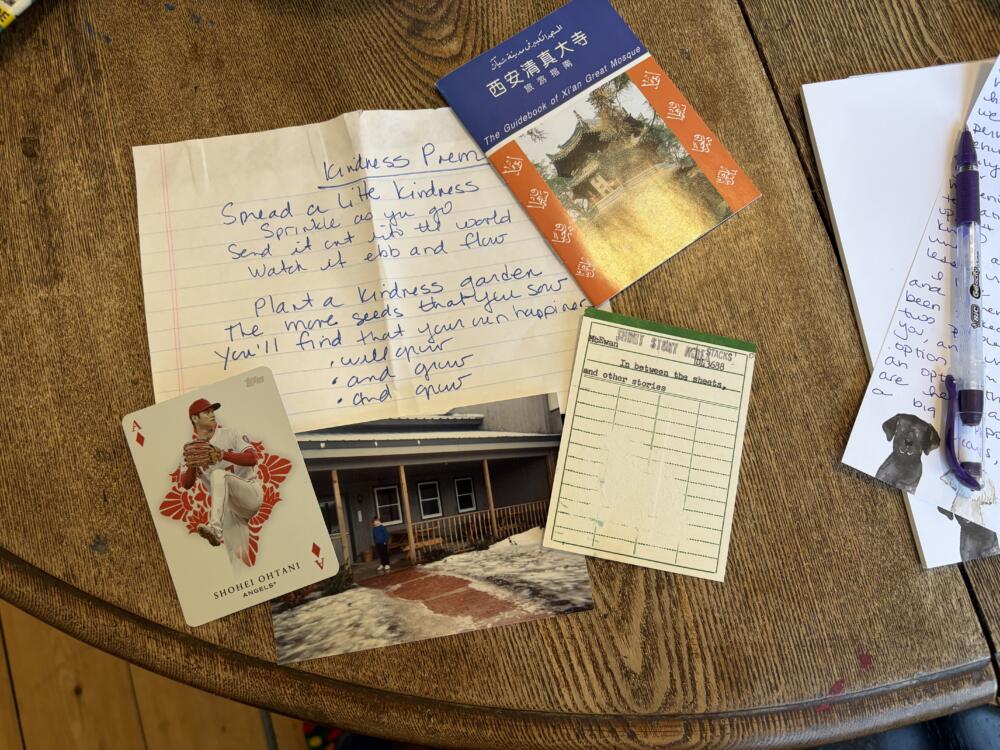 A collection of items from the bookmark box at the author's local library, including a poem by Lauren Jaworksi, handwritten on a piece of paper. (Courtesy Kate Peltz)
