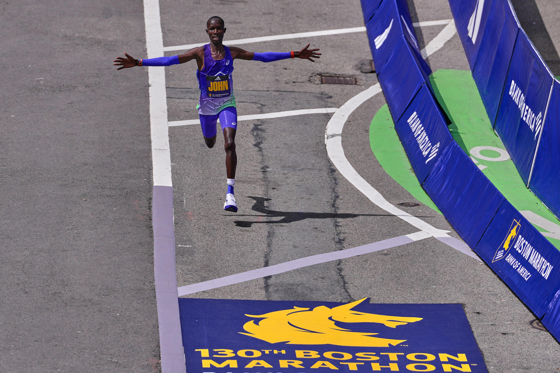 Boston Marathon winner John Korir of Kenya, celebrates while approaching the finish line, April 20, 2026. (Charles Krupa/AP)