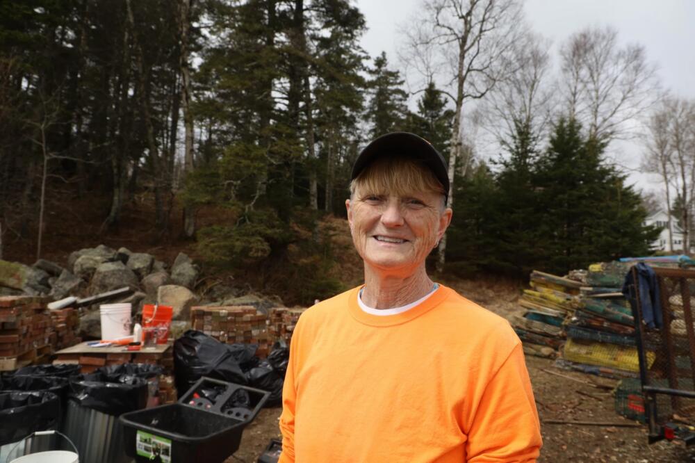 Beba Rosen, a lobster boat captain from Vinalhaven, has spent the past few months processing retired fishing traps on the island. (Tulley Hescock/Maine Public)