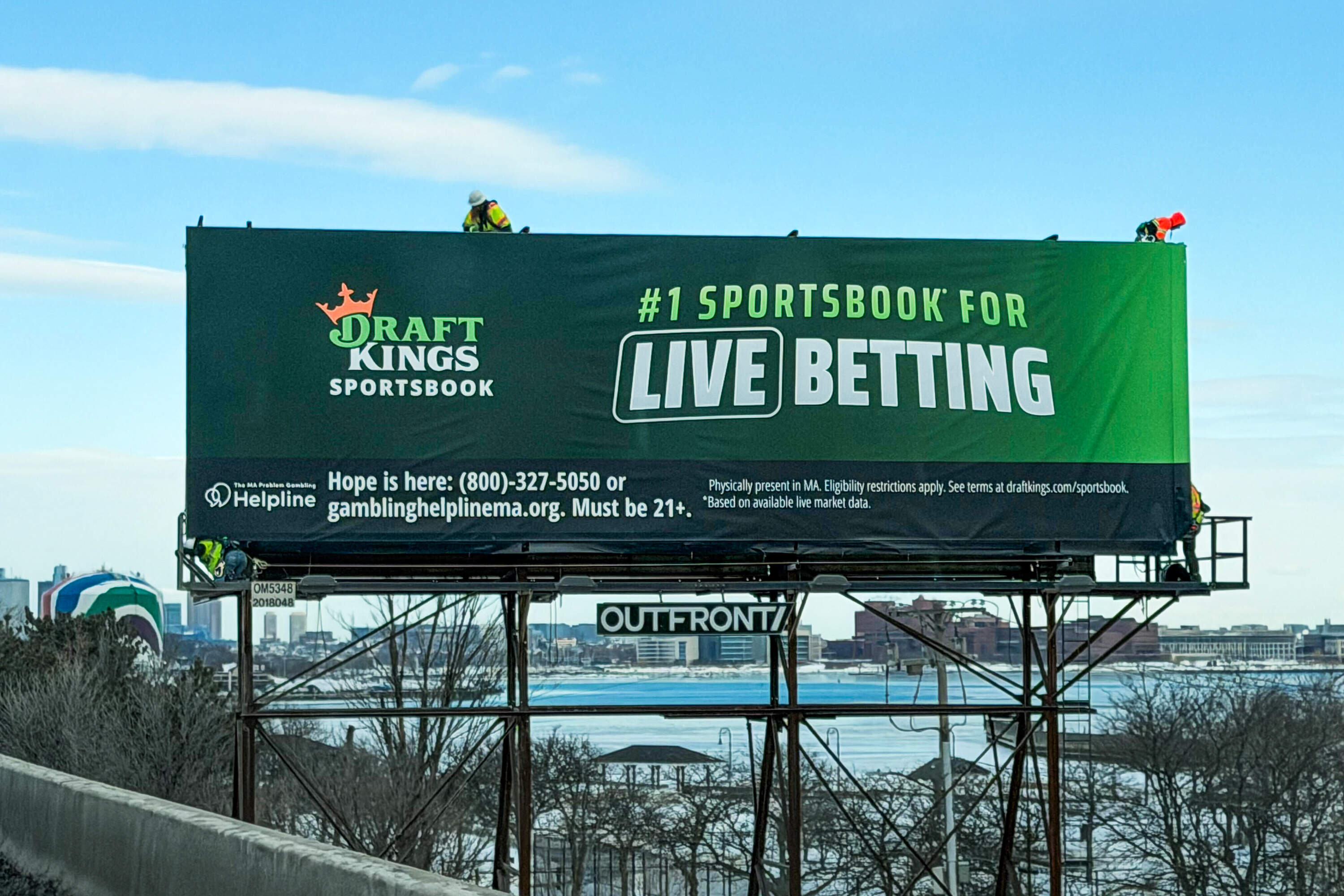 A DraftKings billboard on Route 93 heading toward Boston by Neponset Circle. (Ally Jarmanning/WBUR)