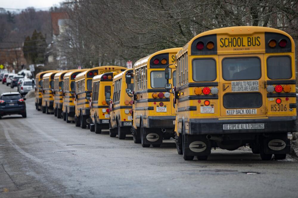 School busses lined up in Boston awaiting students prior to school release. (Jesse Costa/WBUR)
