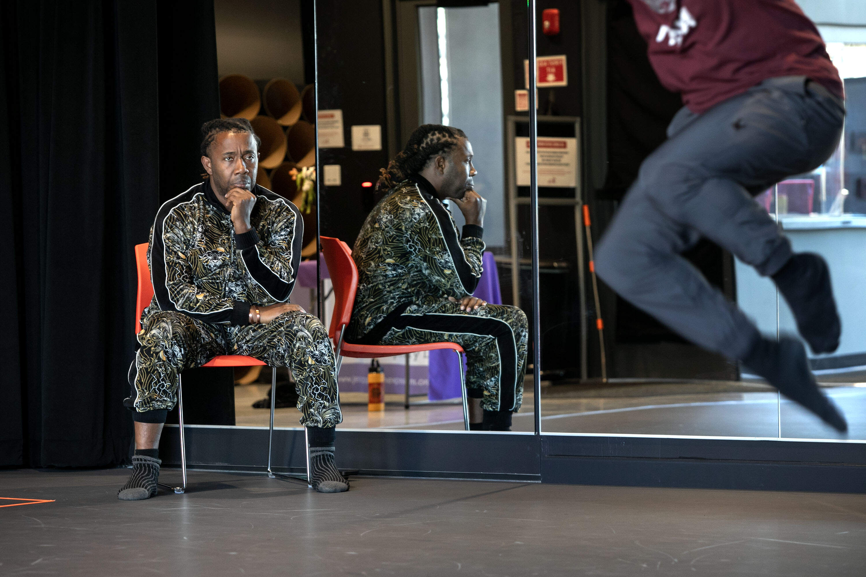 Jean Appolon watches a rehearsal at the Jean Appolon Expressions Dance Center in Nubian Square, Boston. (Robin Lubbock/WBUR)