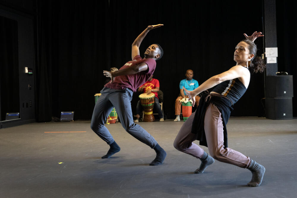 Dancers Mcebisi Xotyeni and Meg McGrath dance at a performance rehearsal at the Jean Appolon Expressions Dance Center in Nubian Square, Roxbury. (Robin Lubbock/WBUR)
