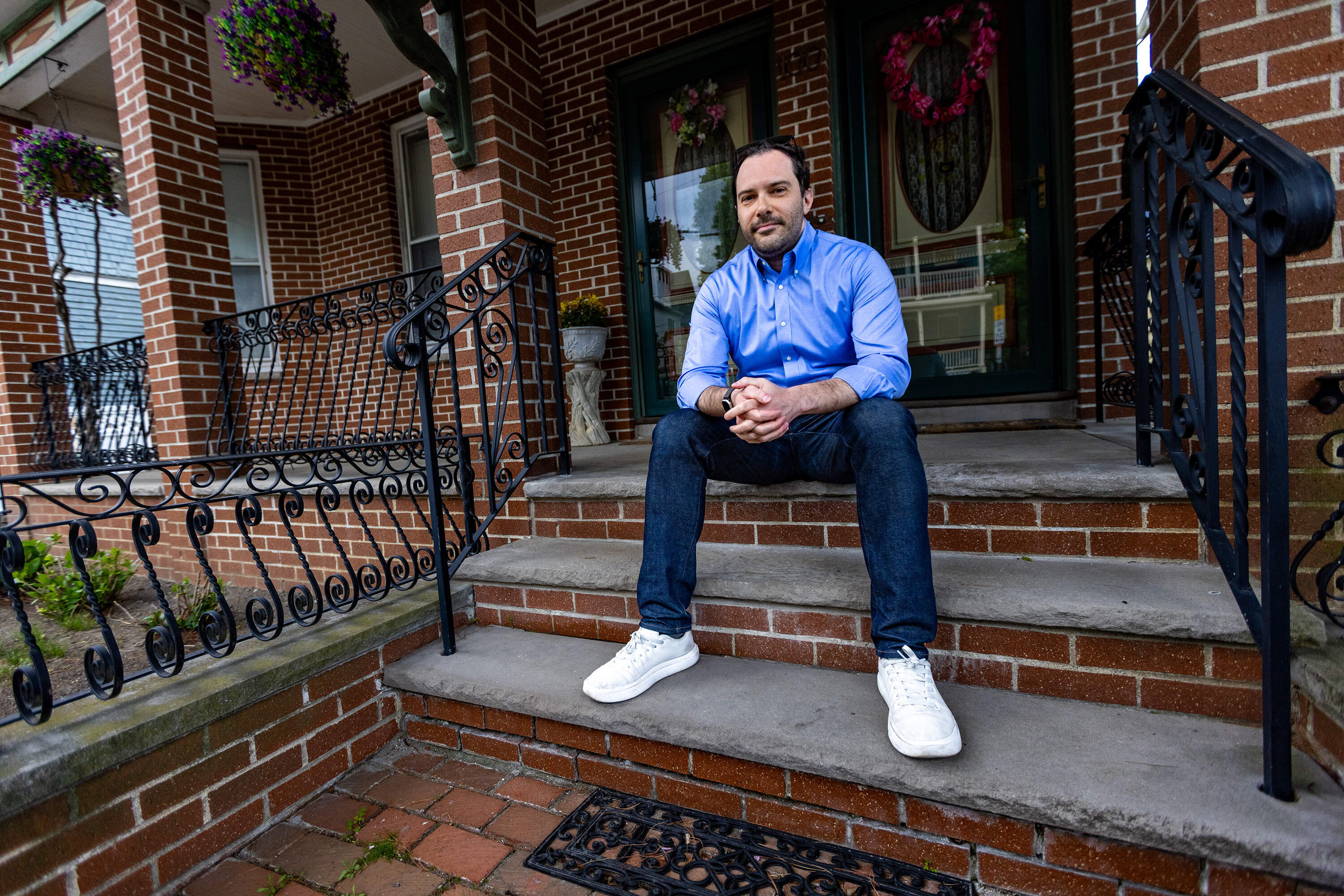 Financial writer Alex Carchidi at his home in Somerville. (Jesse Costa/WBUR)