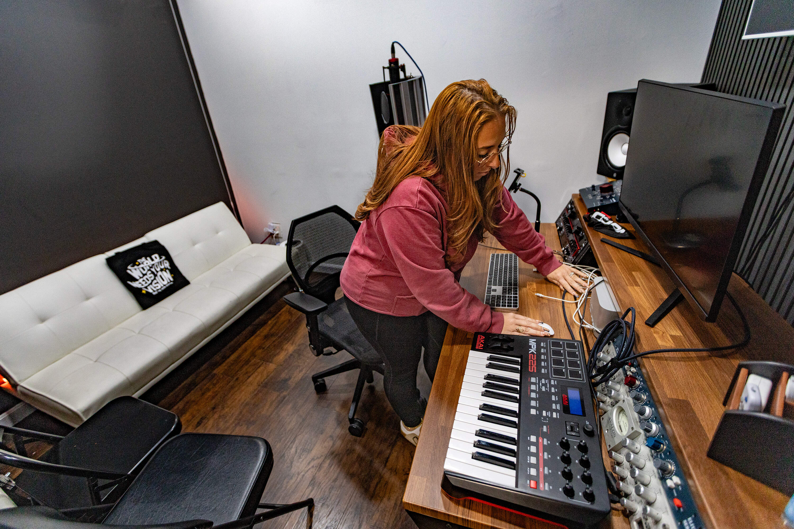 Pagan sets up the sound studio at Beat the Odds in Dorchester. (Jesse Costa/WBUR)