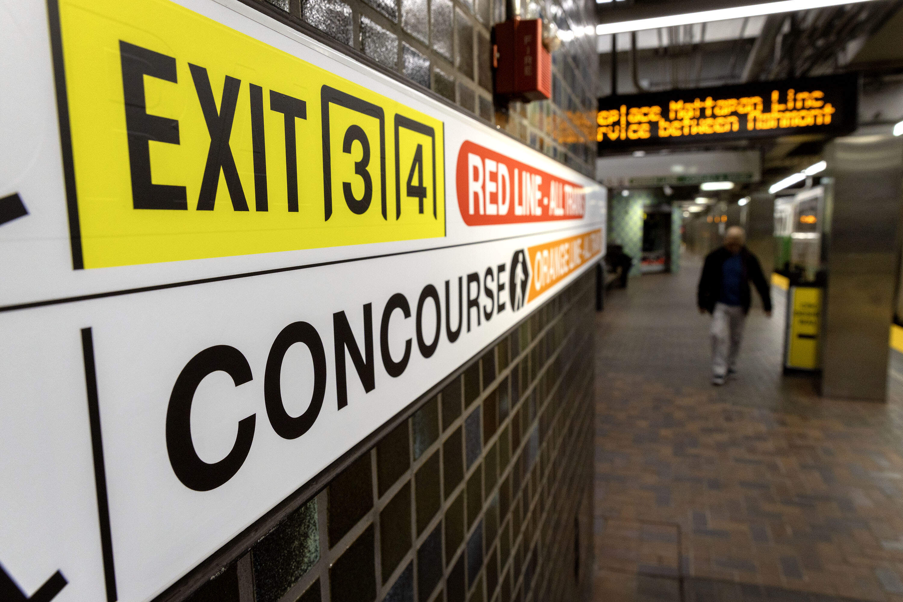 New signs in the Park Street MBTA Station aim to make it easier for travelers find exits and train lines. (Robin Lubbock/WBUR)