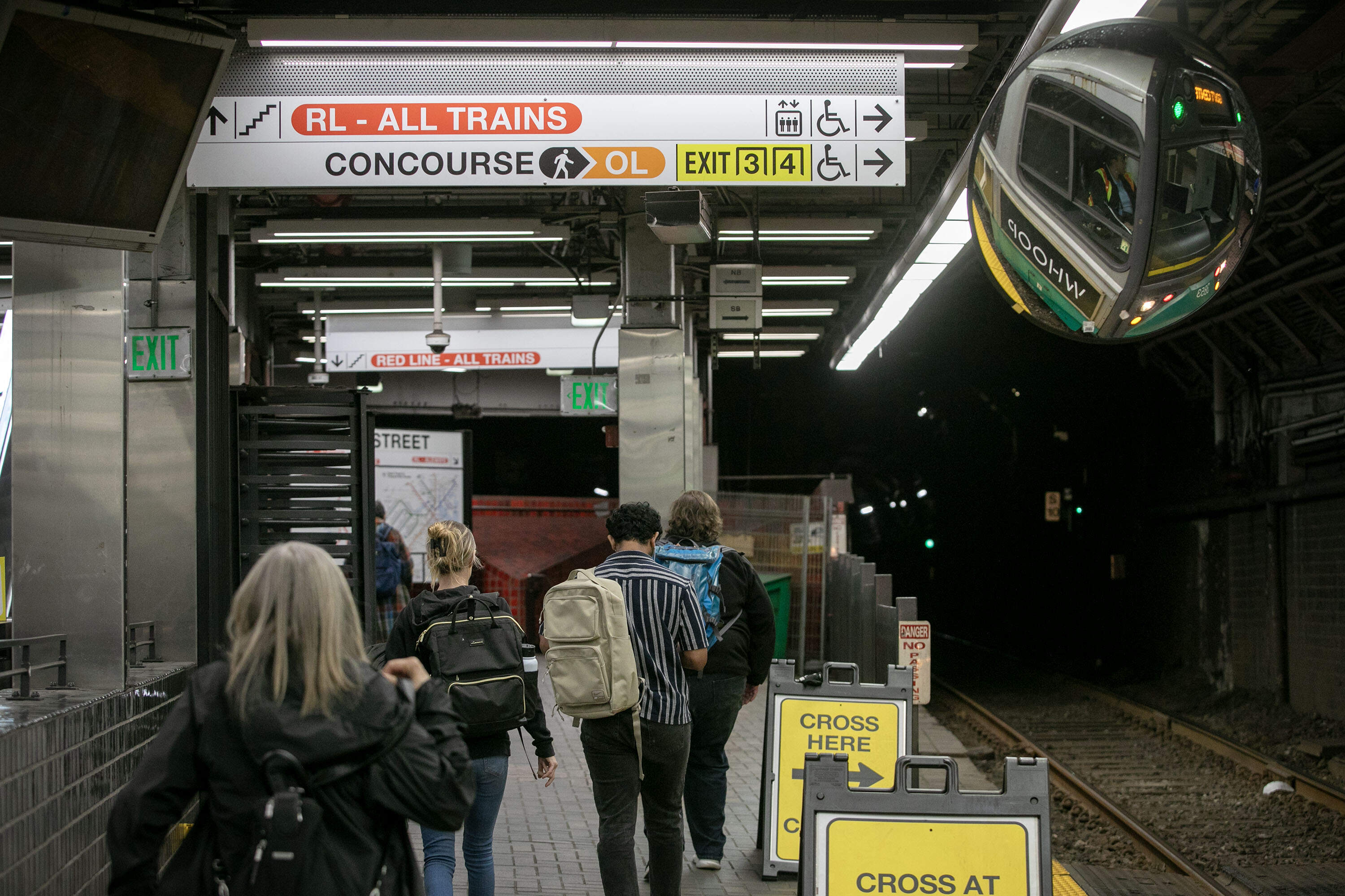 New signs in the Park Street MBTA Station aim to make it easier for travelers find exits and train lines. (Robin Lubbock/WBUR)