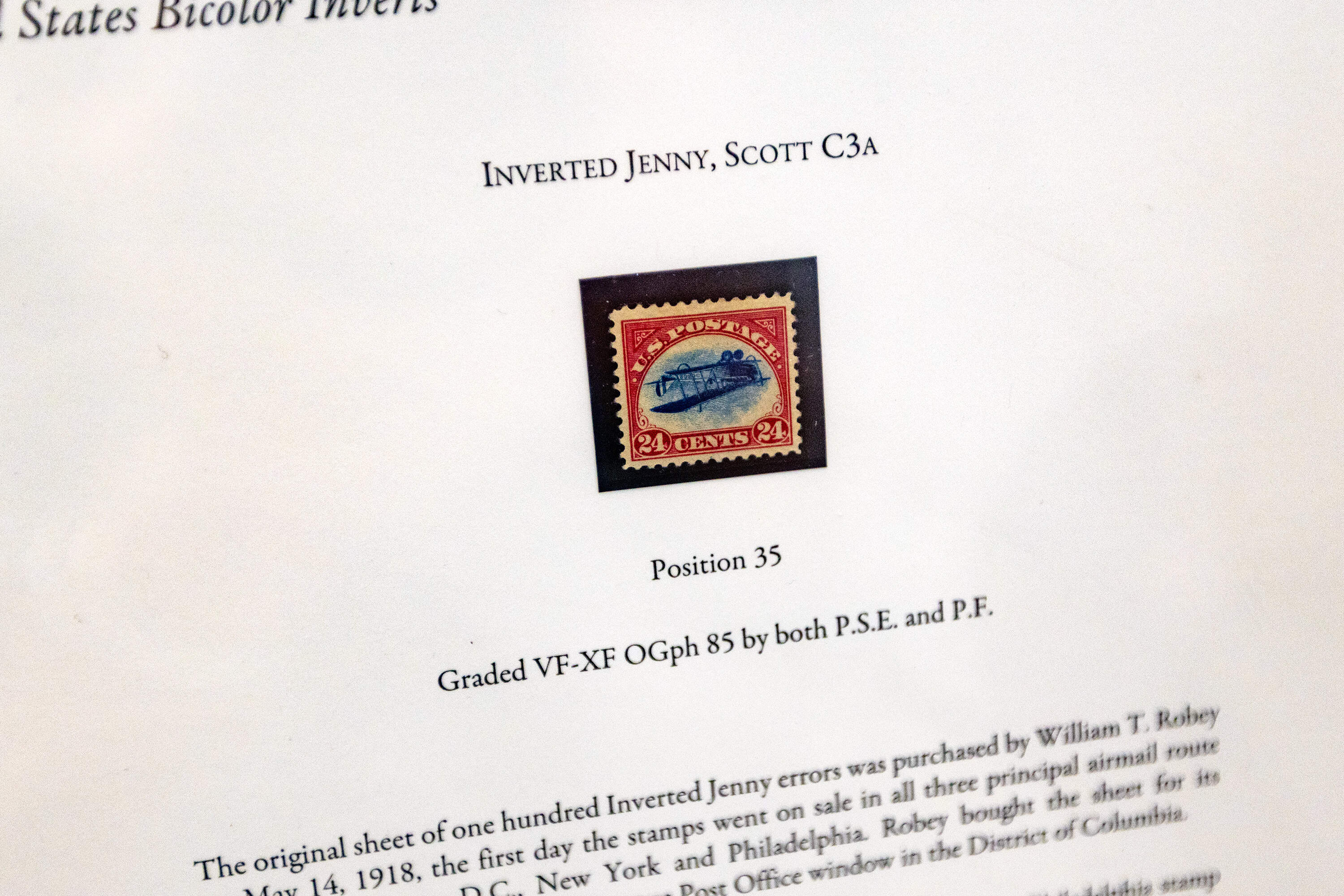 One of the most highly prized stamps in Philately, the 1918 Inverted Jenny, a 24-cent United States airmail stamp famous for a printing error at the Boston 2026 World Expo. (Jesse Costa/WBUR)