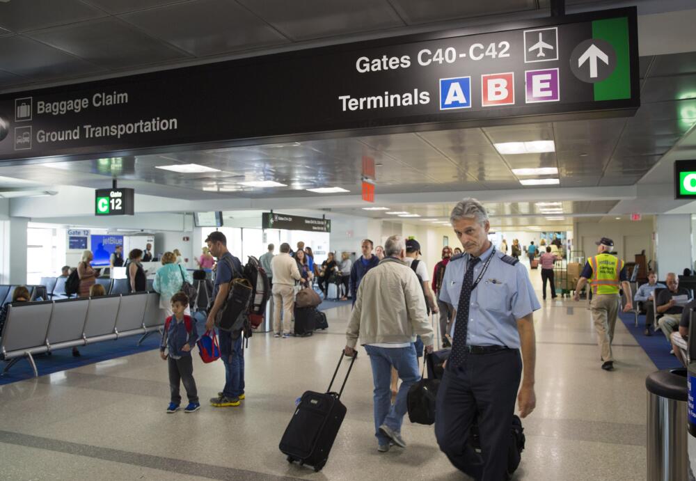 Passengers and flight crew in Terminal C at Logan Airport. (Robin Lubbock/WBUR)