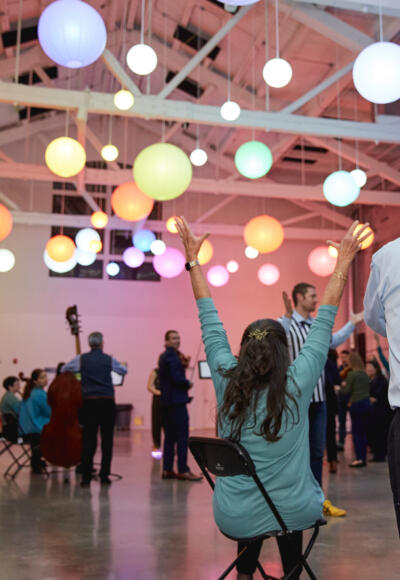 A woman snags a seat in Musical Chairs at an event in Portland, Maine. (Courtesy Emily Isaacson)