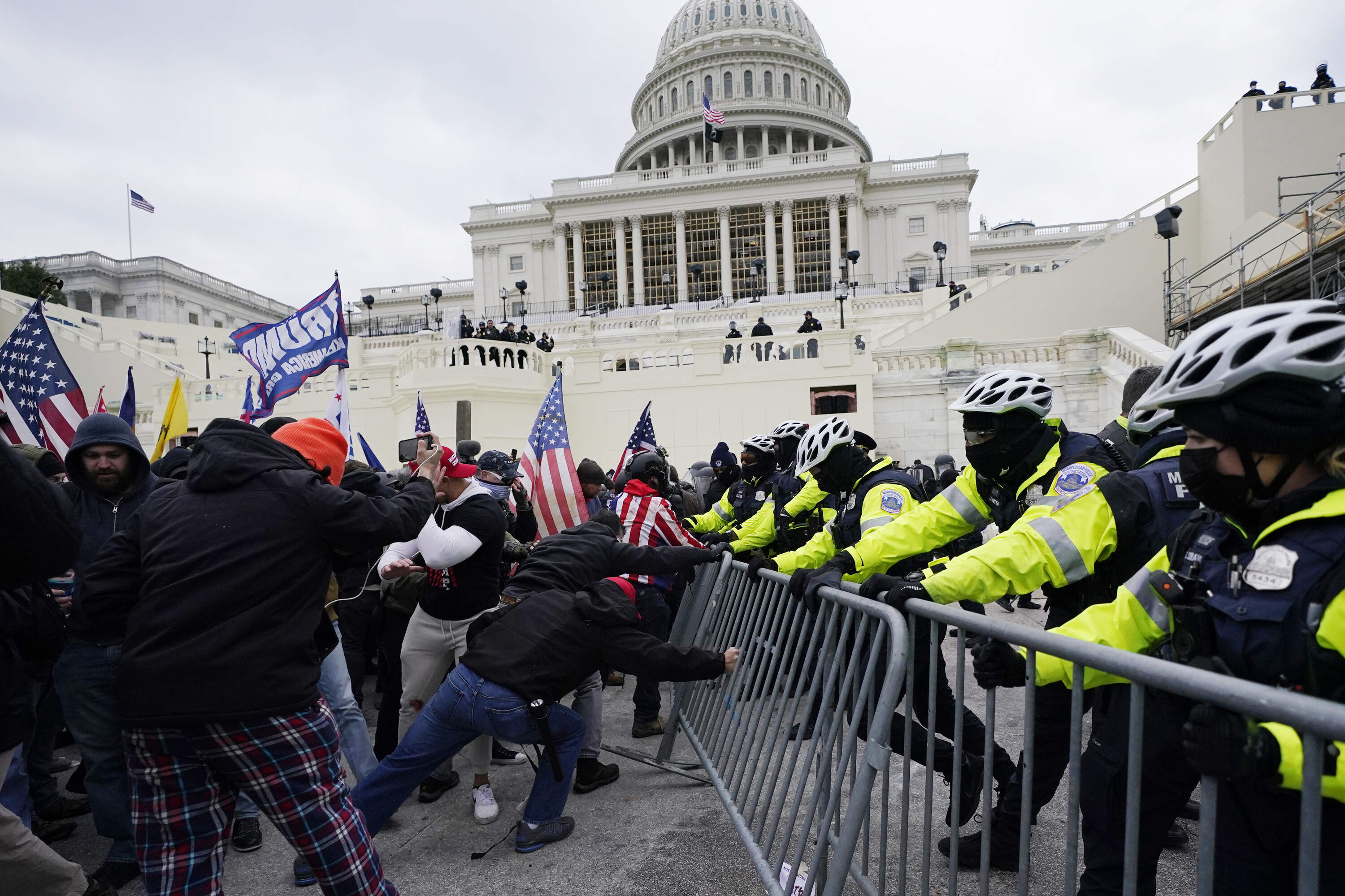 On Jan. 6, 2021, Trump supporters try to break through a police barrier at the Capitol in Washington. (Julio Cortez/AP)