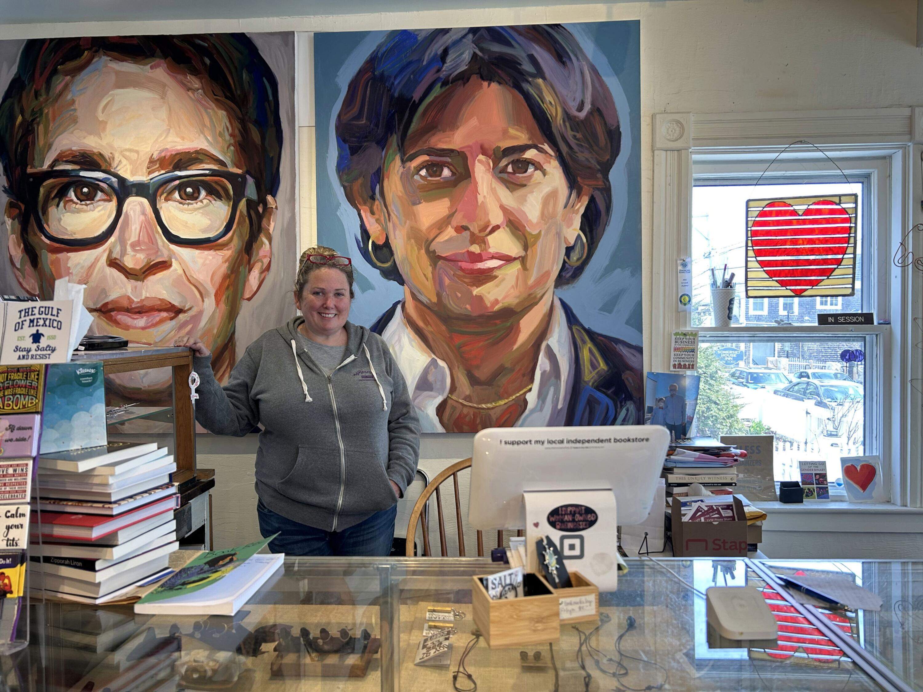 Owner Michelle Axelson standing behind the counter at Womencrafts. (Amanda Beland/WBUR