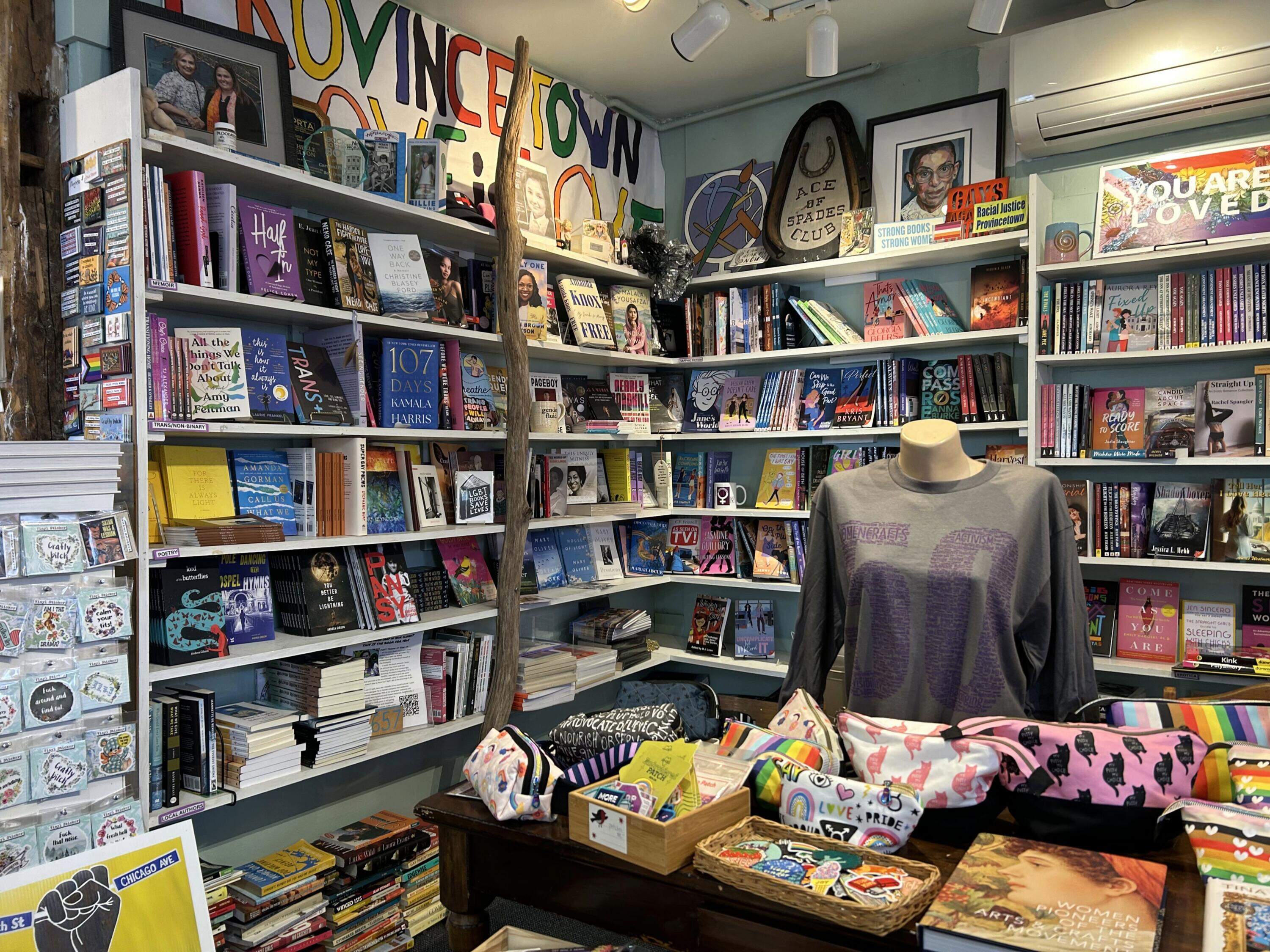 Books, shirts, stickers and more on display at Womencrafts. (Amanda Beland/WBUR)