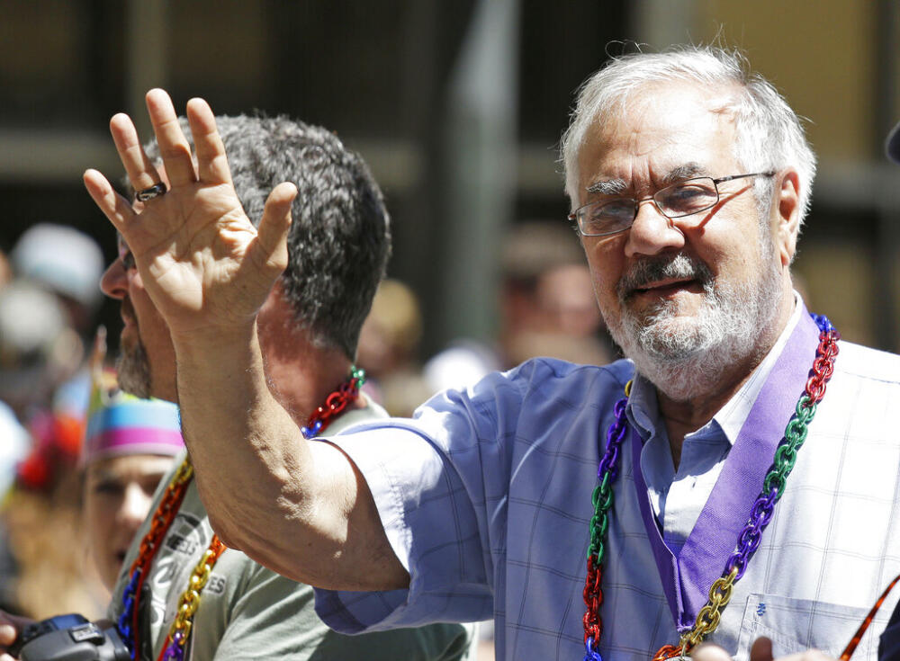 Former congressman Barney Frank, right, waves while riding with his husband James Ready, left, during the 44th annual San Francisco Gay Pride parade on June 29, 2014, in San Francisco. (Eric Risberg/AP file)