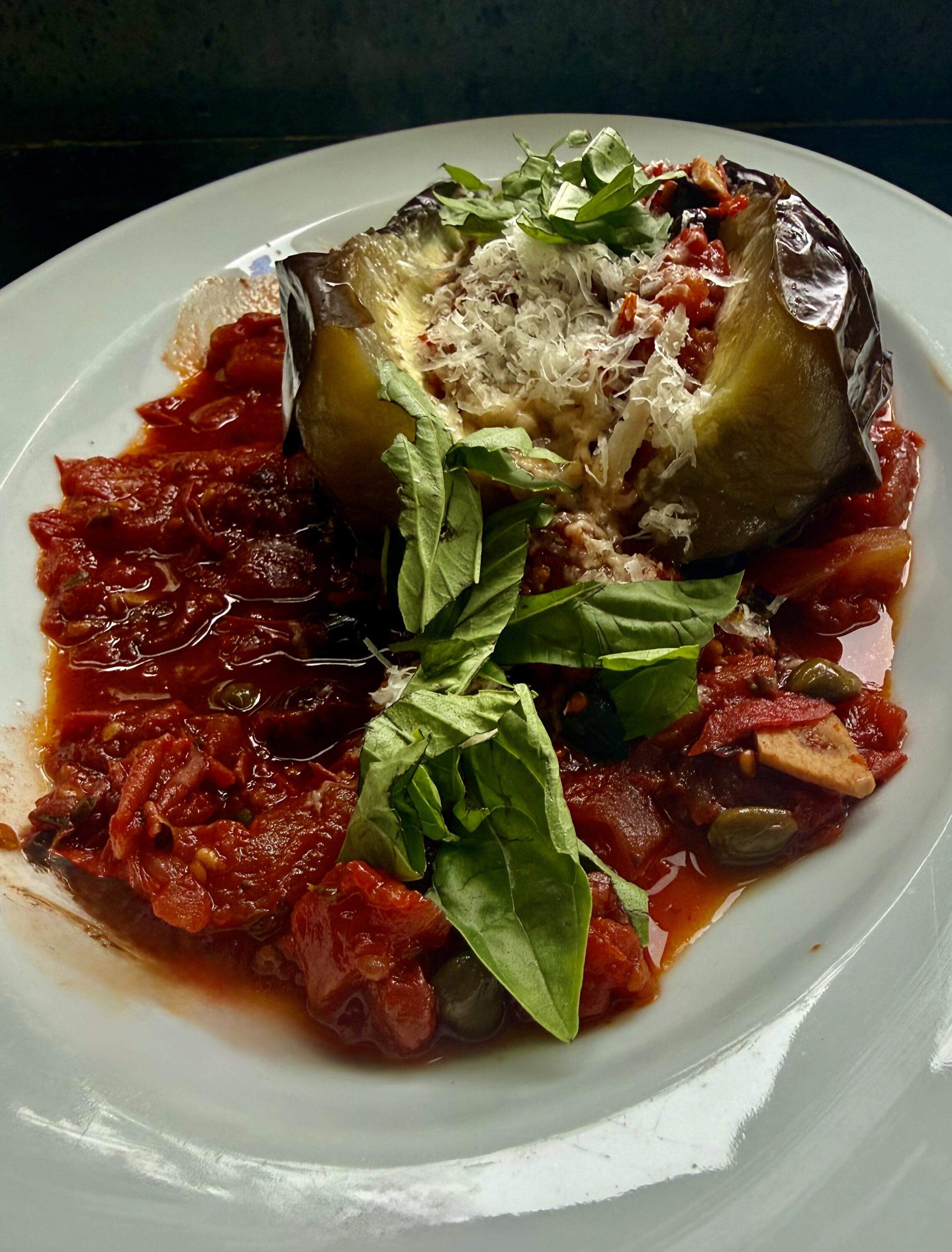 Grilled whole eggplant with tomato sauce and Parmesan. (Kathy Gunst/Here & Now)