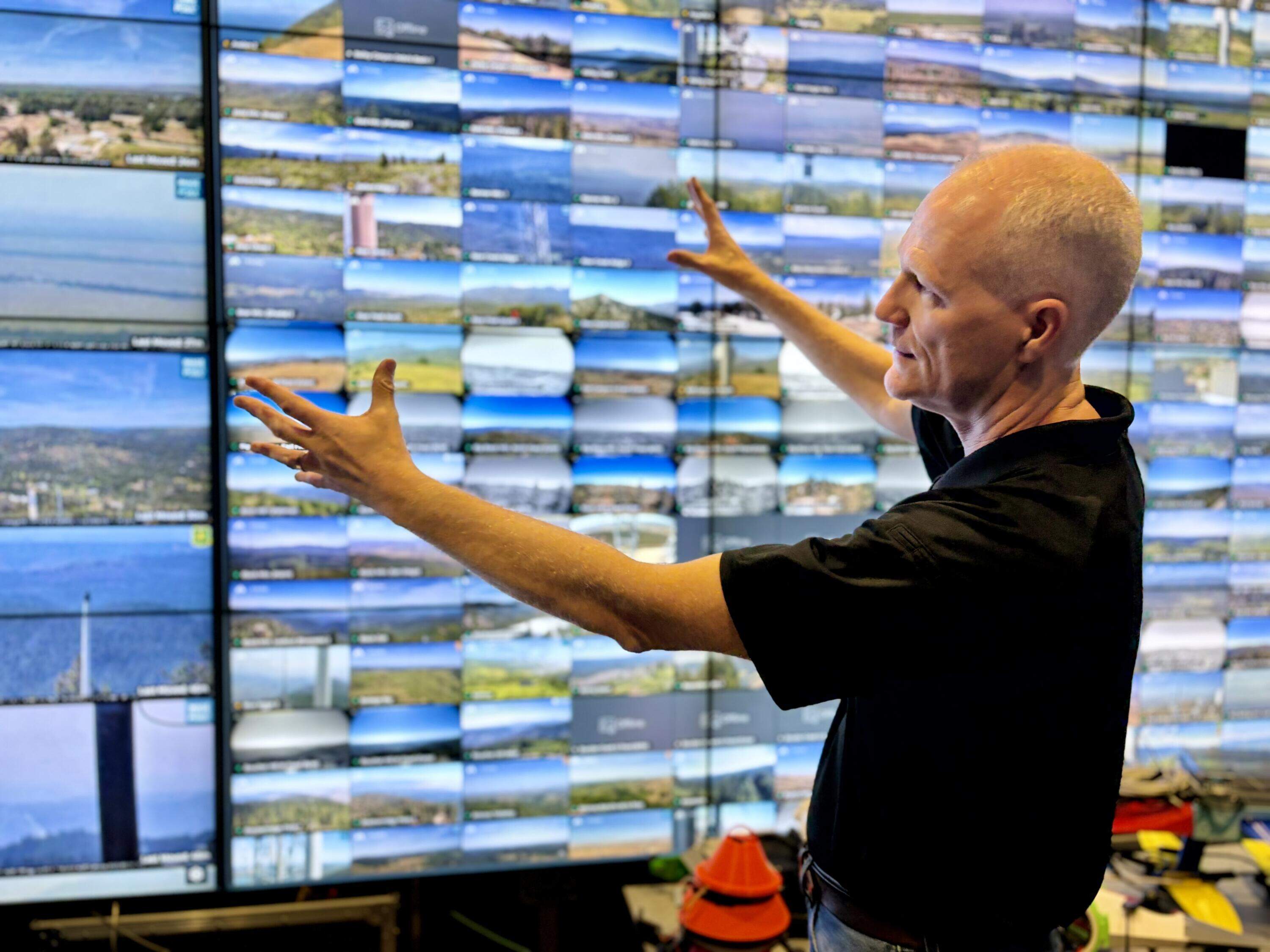 Falko Kuester at the University of California, San Diego watches a live feed of Alert California's cameras positioned around the state. (Peter O'Dowd/Here & Now)
