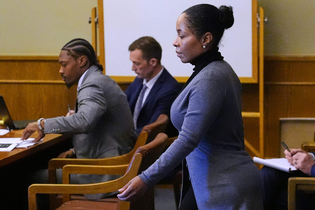 Jamila Adams, right, walks past former New England Patriots wide receiver Stefon Diggs during Diggs' trial at Norfolk County District Court. (Charles Krupa/AP)
