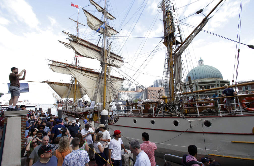 Crowds make their way past the Europa, a tall ship registered in the Netherlands during the Sail Boston event, Sunday, June 18, 2017, in Boston. (Steven Senne/AP Photo)