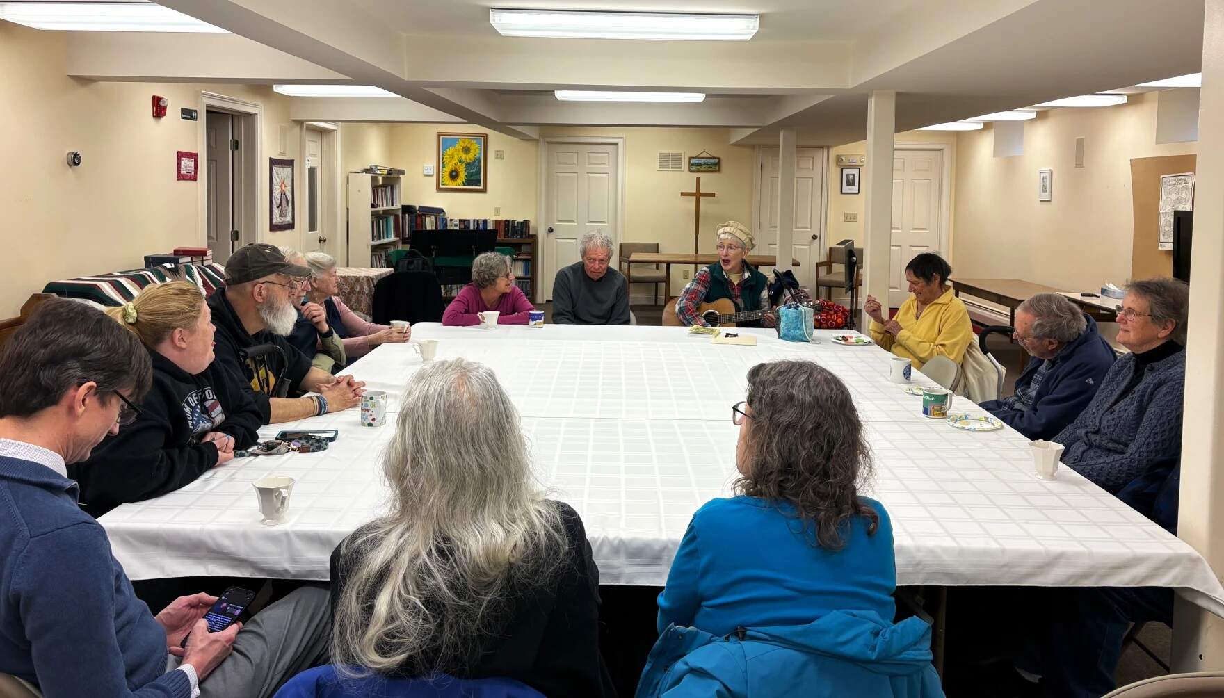 Martha Mitchell leads a monthly singalong at St Luke's Episcopal Church in Chester that's geared for people with memory loss and their caregivers. (Nina Keck/Vermont Public)