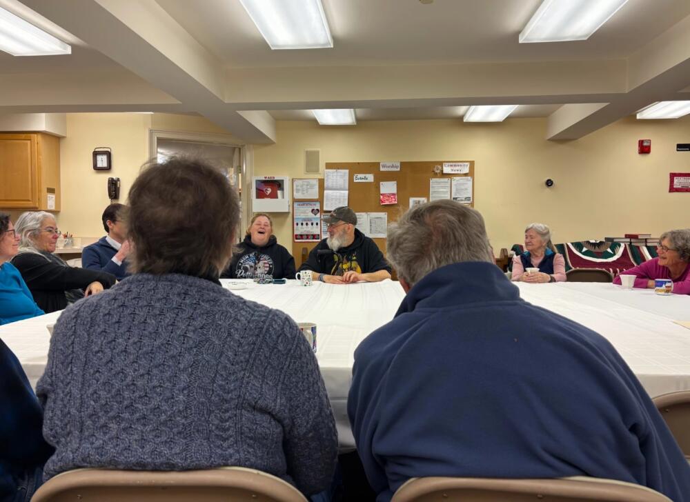 Diane and John Holme have been married 60 years. The couple says they've become regulars at a memory cafe in Chester because of the singing and support they both receive. (Nina Keck/Vermont Public)