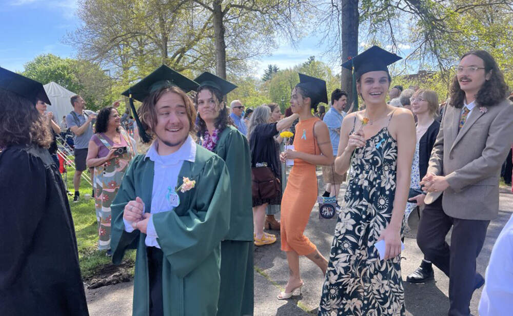 Hampshire College graduates approach the graduation staging area on Saturday in front of the Robert Crown Center on the college’s campus. (Nirvani Williams/NEPM)