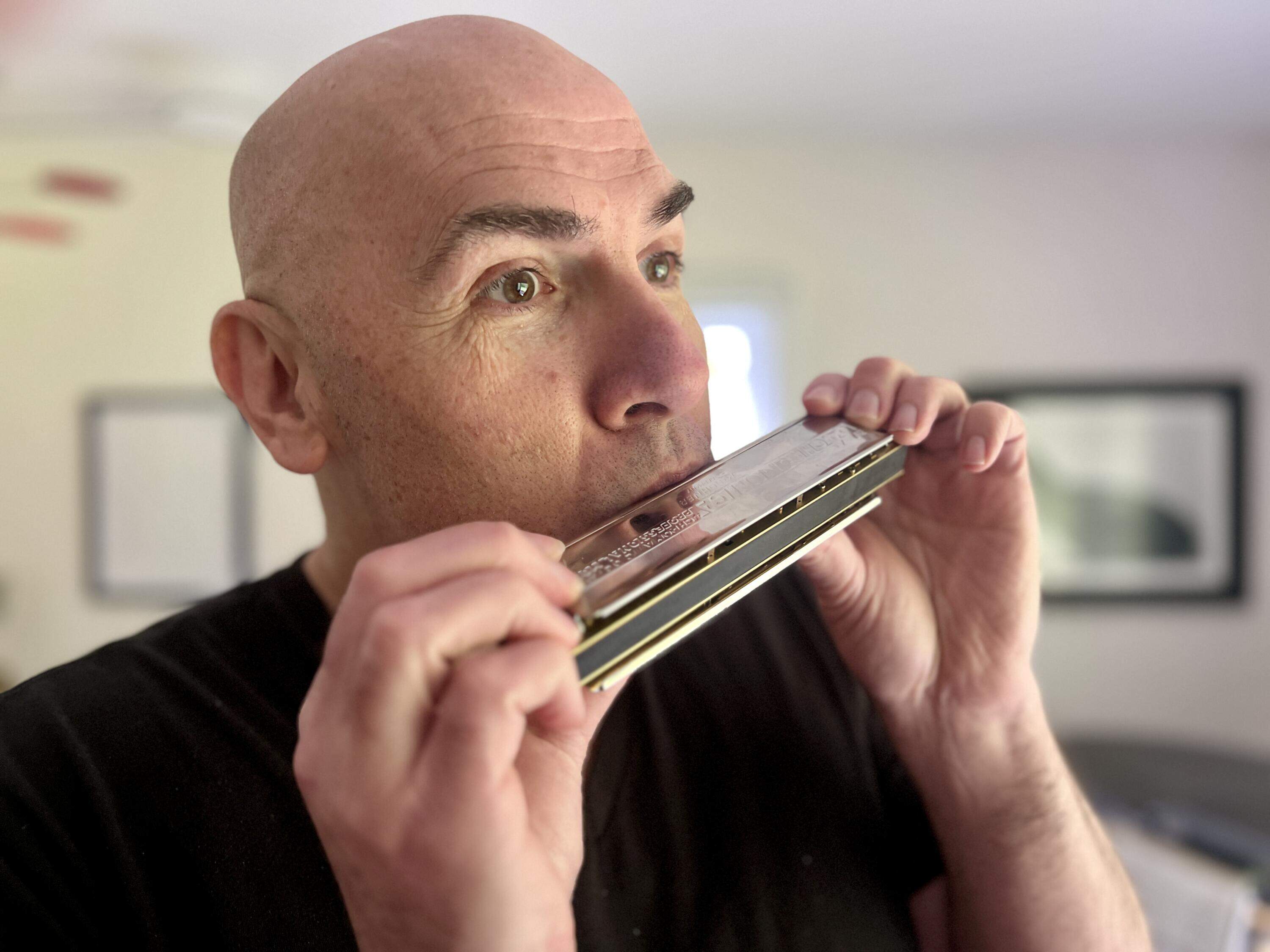Eric Shimelonis plays the harmonica, also known as a French harp or mouth organ. (Courtesy of Rebecca Sheir)